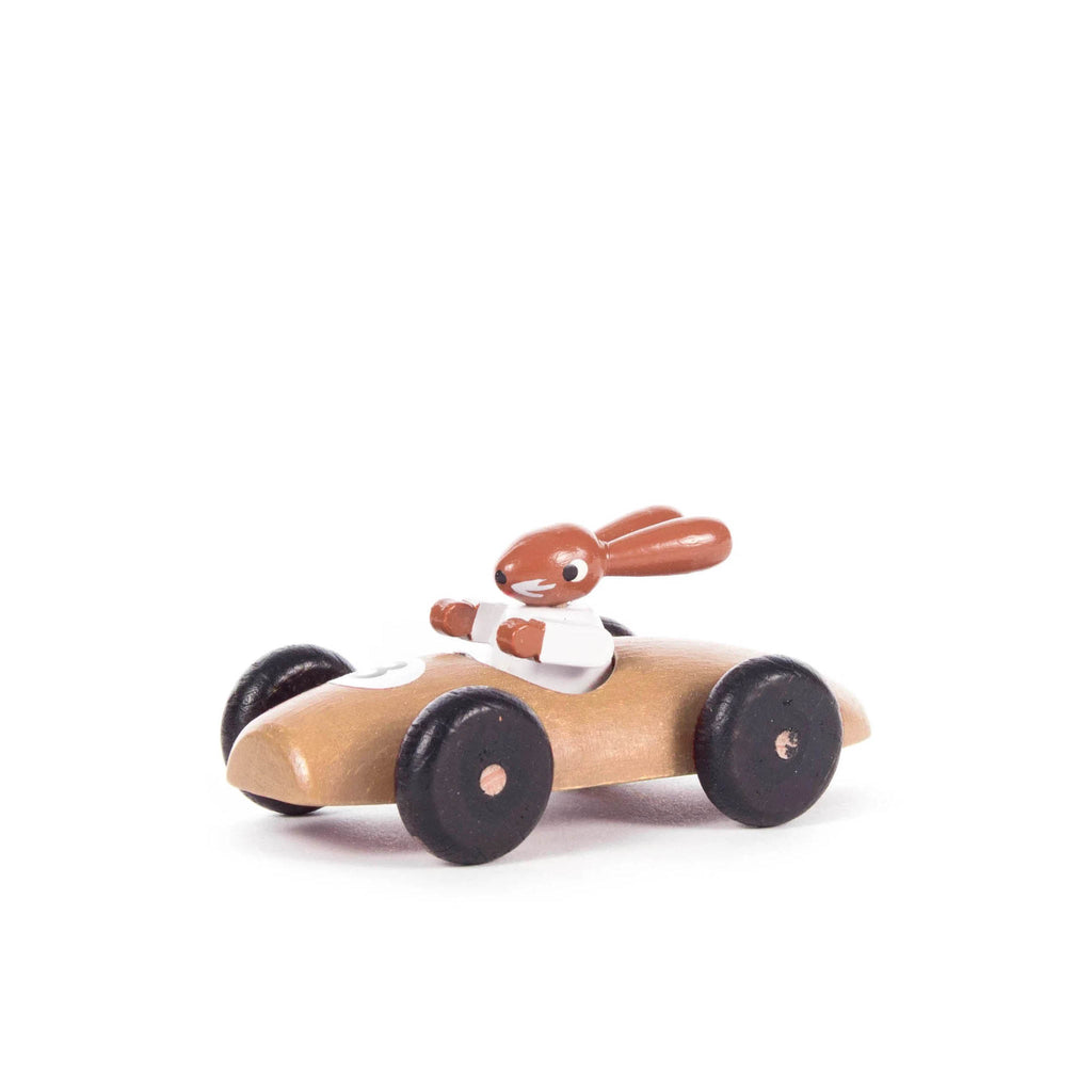 Osterhase in Wooden Racing Car